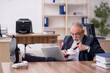 © Elnur - Old male employee drinking coffee during break