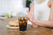 women avoid to eat soft drink and junk food.