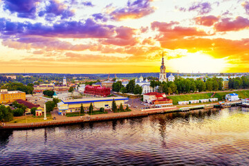 Wall Mural - Aerial drone view of Kineshma ancient city with Volga river in Ivanovo region, Russia. Summer sunny day sunset