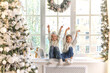 © Inna Vlasova - Cute little kids, boy and girl sitting on window sill