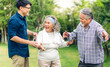 © Art_Photo - Portrait enjoy happy smiling love multi-generation asian family.Senior mature father and elderly mother with young son adult man walking outdoor in park at home.insurance concept