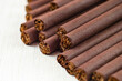 Cigarettes in brown paper on a white background close up. Macro