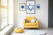 Paintings Of David Stars Hanging On Light Wall In Interior Of Room