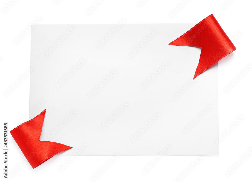 Blank sheet of paper with red ribbons on white background