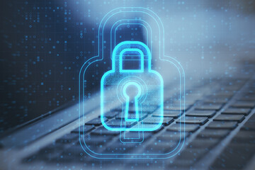 Poster - Close up of laptop with glowing padlock hologram on blurry background. Internet safety and security concept. Double exposure.