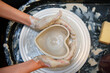 Woman hands doing pottery top view