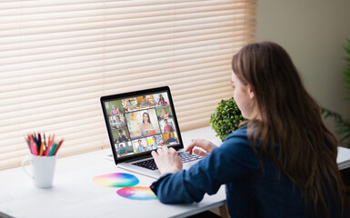 Poster - Caucasian girl using laptop for video call, with smiling diverse elementary school pupils on screen