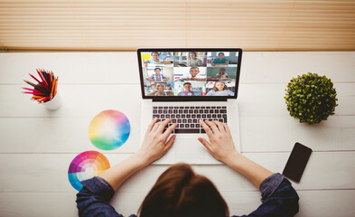 Poster - Caucasian woman using laptop for video call, with smiling diverse elementary school pupils on screen