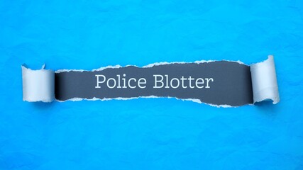 Wall Mural - Police Blotter. Blue torn paper banner with text label. Word in gray hole.