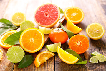 Wall Mural - various citrus fruits and leaves - orange,  grapefruit,  lemon
