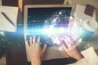 © peshkova - Double exposure of woman hands typing on computer and social network theme hologram drawing. People media concept.