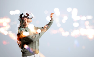 Poster - Businesswoman in green sweater is wearing vr helmet