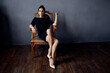 © SHOTPRIME STUDIO - beautiful woman earrings jewelry posing near the chair black dress dark background