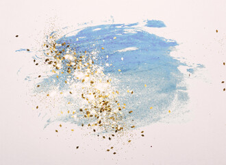  Golden glitter on abstract blue watercolor splashes in vintage nostalgic colors