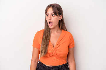 Wall Mural - Young caucasian woman isolated on white background being shocked because of something she has seen.