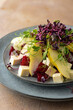 Salad with pear, feta, beetroot and microgreens.