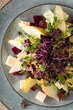 Salad with pear, feta, beetroot and microgreens.