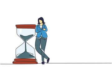 Poster - Single continuous line drawing businesswoman lean on huge giant hourglass. Time is money financial investment concept. Time management conceptual metaphor. One line draw design vector illustration