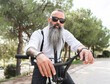 © ADDICTIVE STOCK - Bearded hipster man on bicycle