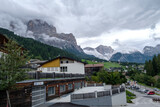 Fototapeta Natura - Corvara - August 2020: view of the center of San Cassiano with Dolomiti on the background