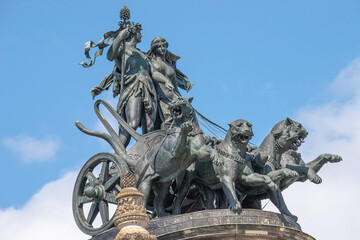 Canvas Print - Old statue of Dionis and Aridna quadriga with four panthers on the top of the State Opera House in downtown of Dresden, Germany, details, closeup