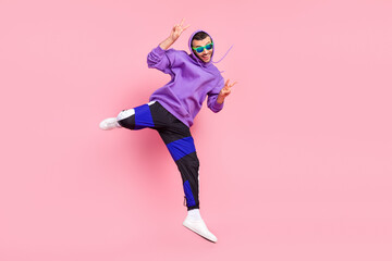 Wall Mural - Full body photo of funny young brunet guy jump wear eyewear hoodie pants shoes isolated on pink background