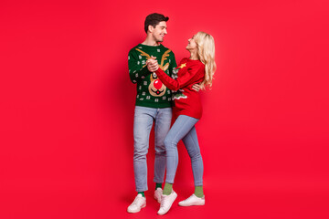 Poster - Photo of carefree couple in love dance wear ugly pullover jeans footwear isolated red color background