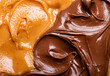 Closeup of peanut butter and chocolate paste texture, from above flat lay