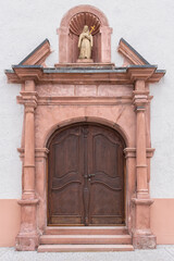 Wall Mural - old church wooden door with ornaments in the historic part of the small German town of Tauberbischofsheim