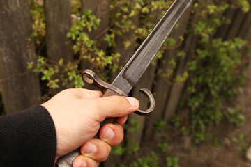 Poster - Vintage bayonet knife in the hand