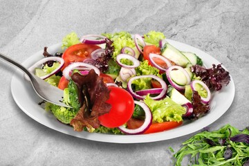 Poster - Green salad with greens and tomatoes. Healthy vegan dish.