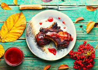 Canvas Print - Grilled pork with viburnum,wooden background