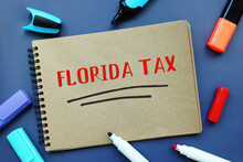 Business Concept Meaning FLORIDA TAX With Inscription On The Sheet.