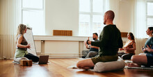 Yoga Instructor Teaching Breathing Exercises