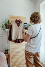 Woman Taking Picture Of Wardrobe