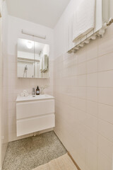 Poster - Vertical shot of a white furnished bathroom design