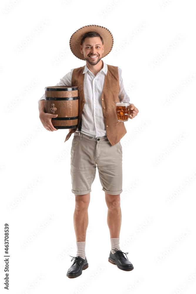 Young man in traditional German clothes with beer and barrel on white background