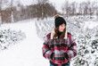 © Melanie DeFazio/Stocksy - A portrait of a young woman in the snow
