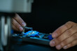 © Manu Padilla/Stocksy - Crop technician installing microchip under microscope