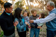 © Erin Brant/Stocksy - Laughing Asian granddaughters with family
