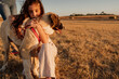 © Eloisa Ramos/Stocksy - Adorable girl loving her dog