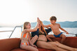 © Studio Firma/Stocksy - Woman and Children on Boat