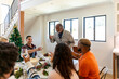 © Jayme Burrows/Stocksy - Mature Man Makes a Toast at Holiday Dinner
