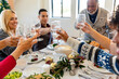 © Jayme Burrows/Stocksy - Family Toasts During Dinner