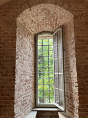 Wall Mural - Closeup shot of a long window in a building with bricks