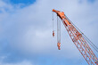 © Rowena Naylor/Stocksy - Large industrial crane masts at gas site