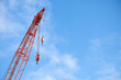 © Rowena Naylor/Stocksy - Large industrial crane masts at gas site
