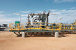© Rowena Naylor/Stocksy - Completed onshore gas well head
