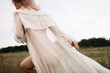 © Sergey Filimonov/Stocksy - Carefree woman in white dress
