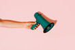 © Juan Moyano/Stocksy - woman has a green megaphone